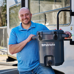 Man holding the Patriot Pure Outdoor Filtration System